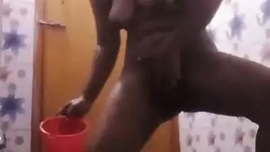 Bhabhi in bathroom baths and fingers cunt in horny mood