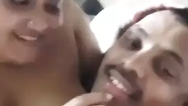 Chubby wife soft boobs pressed against husband in foreplay