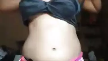Naked Desi girl with XXX tits and hairy pussy puts clothes on slowly