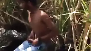 Indian outdoor sex of a guy and his GF in the bushes