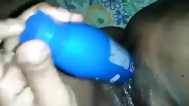 Hot Desi female shows off her smooth XXX pussy shoving a sex toy inside