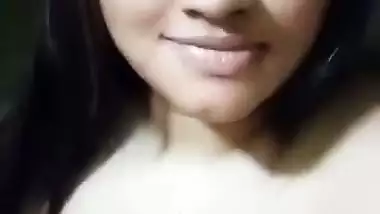 Cute girl opens bra to show sexy boobs to lover