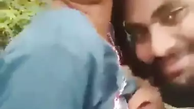 Indian outdoor sex of a guy sucking his GF’s tight boobs
